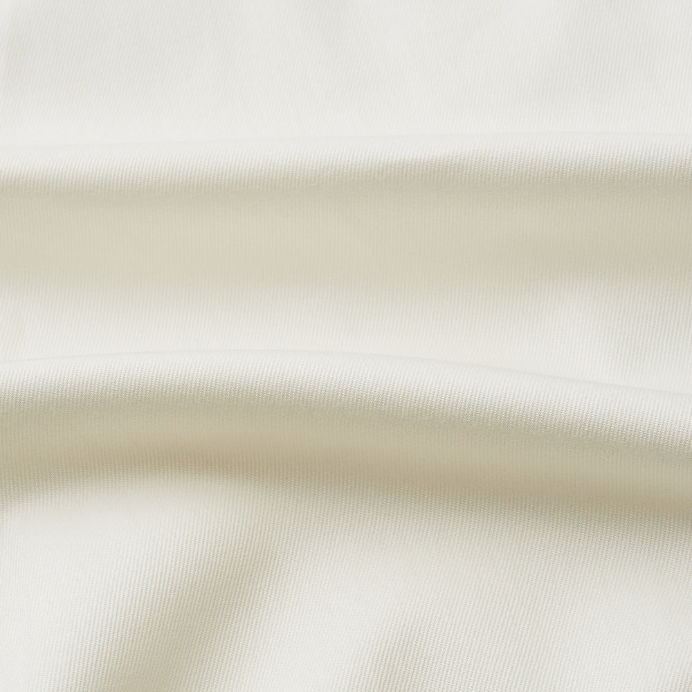 The Turnbull & Asser Cream Cotton Weekend Fit Unwin Shirt features long sleeves, a stand collar, and two chest pockets, shown laid flat on a white background.