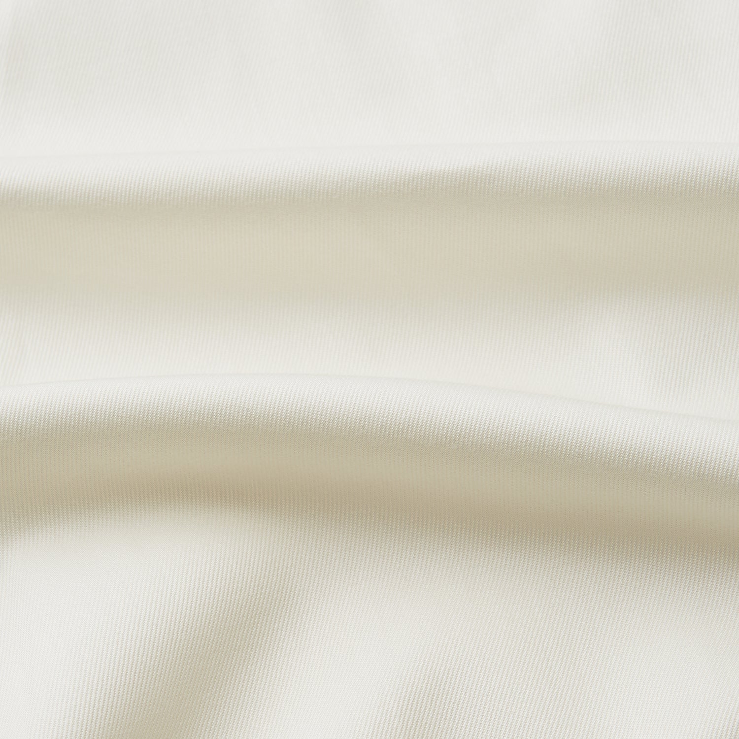 View 3 of product The Turnbull & Asser Cream Cotton Weekend Fit Unwin Shirt features long sleeves, a stand collar, and two chest pockets, shown laid flat on a white background.
