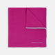 The Fuchsia and White Piped Silk Pocket Square by Turnbull & Asser features white edges and the brand’s name printed in white in the bottom right corner—a timeless men’s accessory.