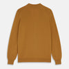 View 3 of product The Turnbull & Asser Golden Brown Cashmere Lachlan Cardigan features long sleeves, front buttons, two front pockets, and ribbed cuffs and hem—a luxurious knitwear piece shown laid flat on a white background.