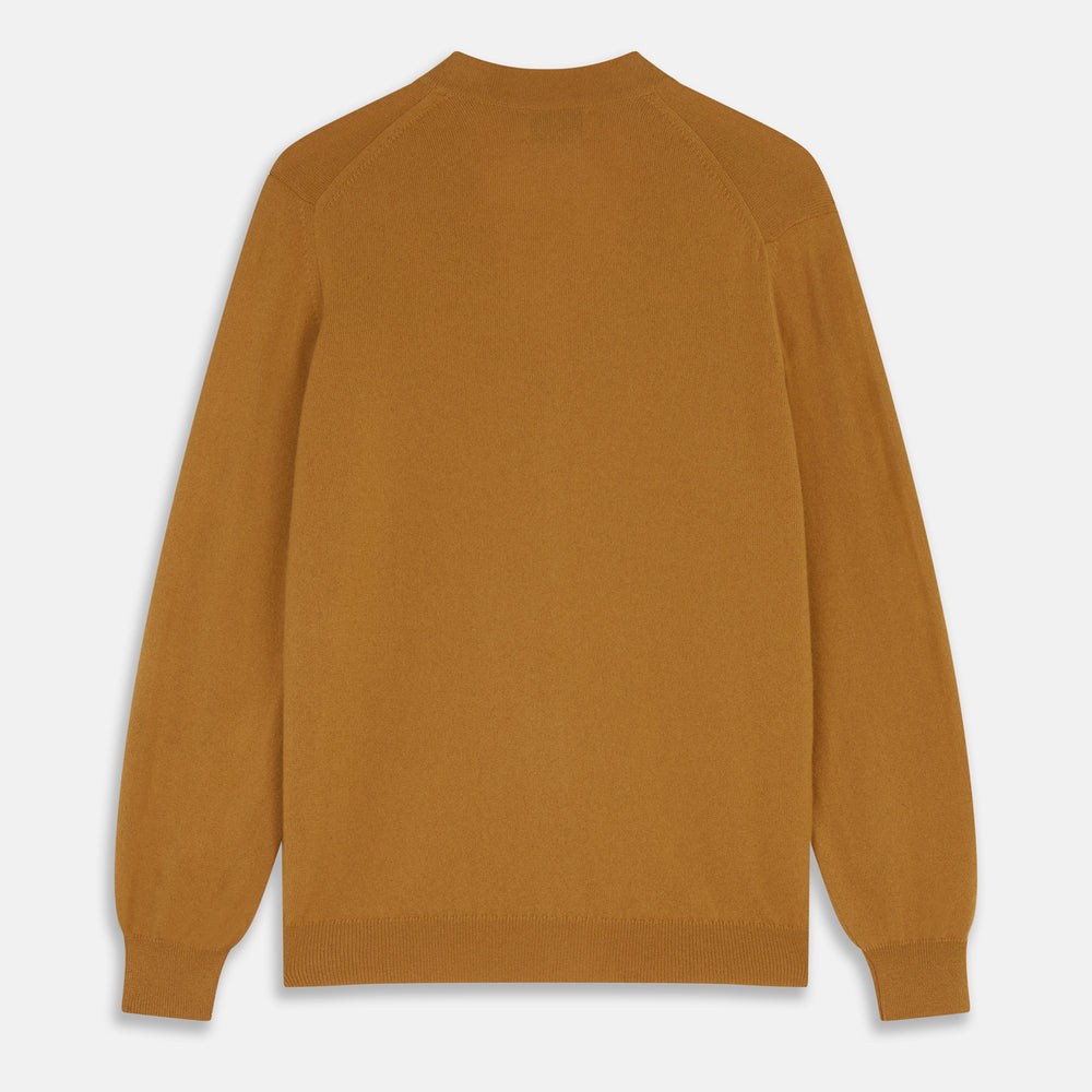 The Turnbull & Asser Golden Brown Cashmere Lachlan Cardigan features long sleeves, front buttons, two front pockets, and ribbed cuffs and hem—a luxurious knitwear piece shown laid flat on a white background.