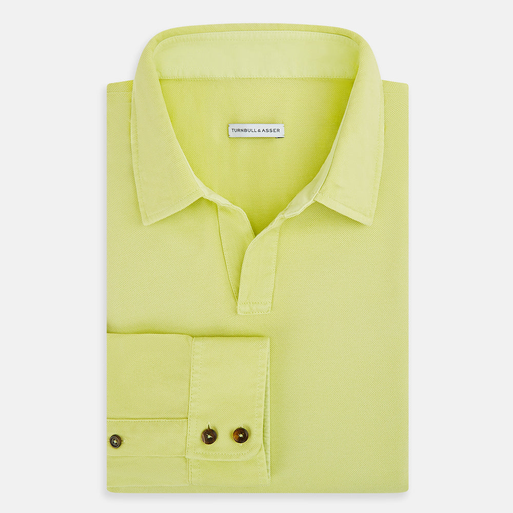 The Turnbull & Asser Lime Green Rugby Polo Shirt is a pure cotton, long-sleeve shirt with a collar and no visible buttons, displayed flat against a white background.