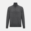 View 1 of product The Turnbull & Asser Charcoal Grey Melange Half-Zip Cashmere Jumper features a high collar, quarter-zip design, and long sleeves, shown against a plain white background.