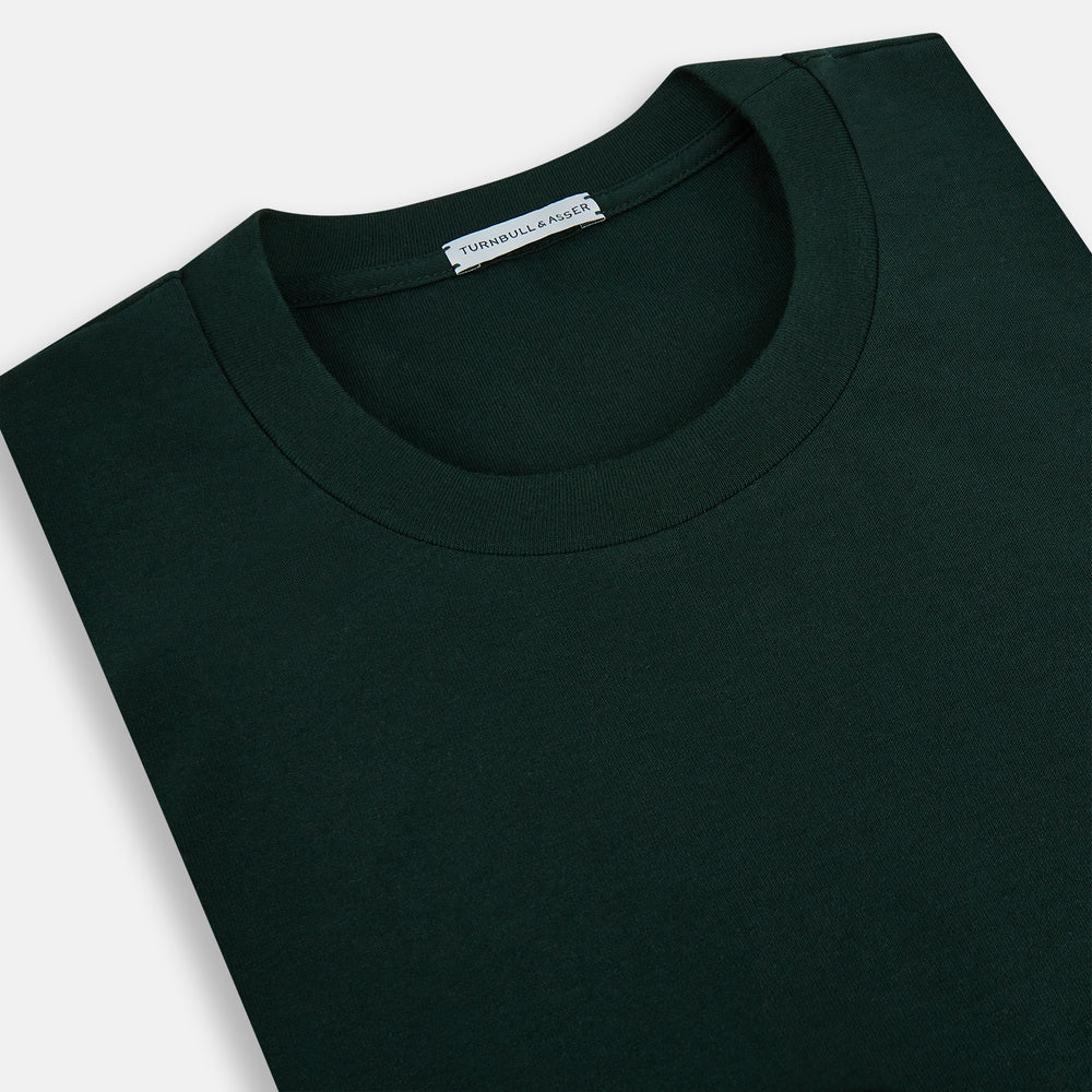 A forest green long-sleeve crewneck t-shirt by Turnbull & Asser is laid flat on a white background, showing the front side with no visible patterns or logos—a timeless, versatile staple.