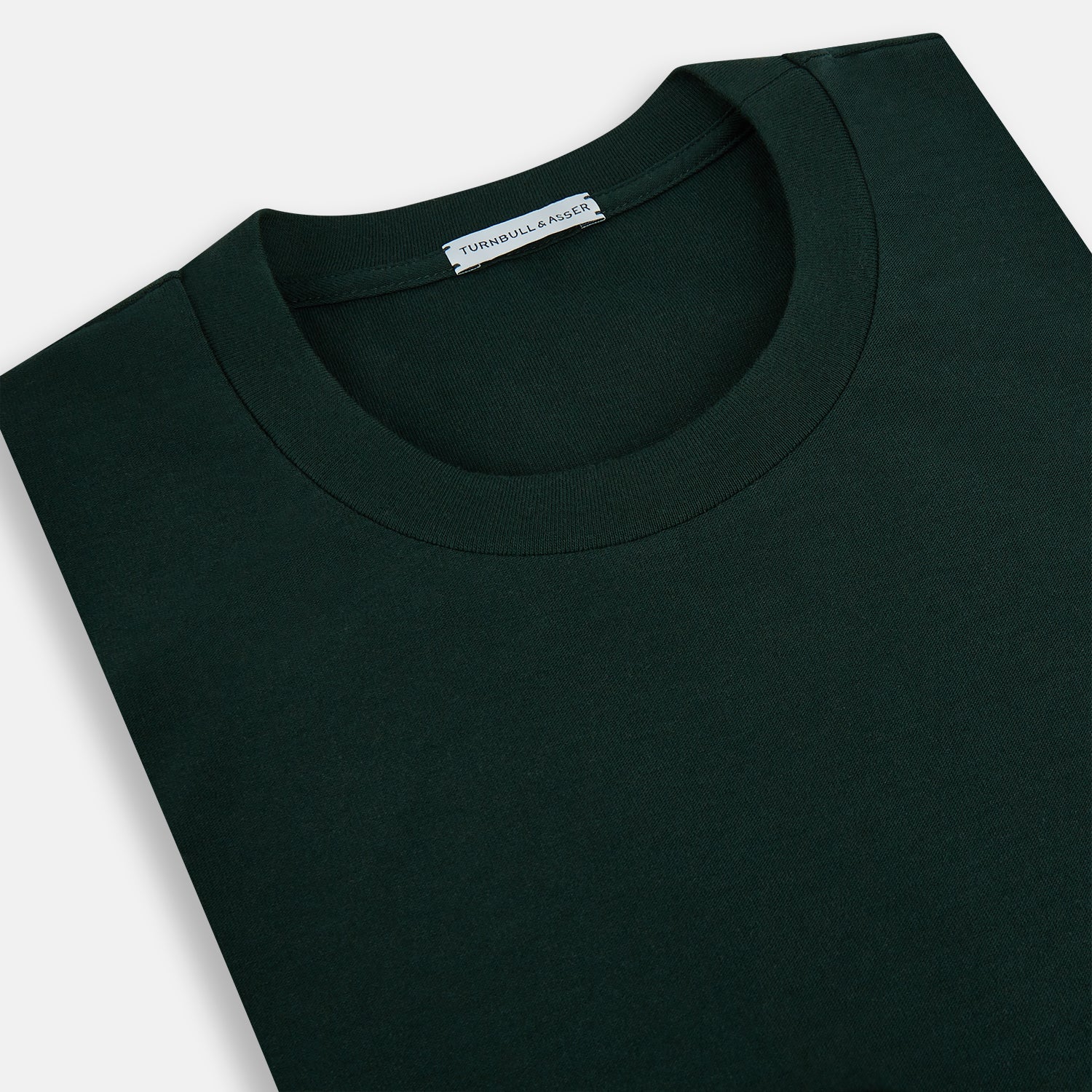 View 2 of product A forest green long-sleeve crewneck t-shirt by Turnbull & Asser is laid flat on a white background, showing the front side with no visible patterns or logos—a timeless, versatile staple.