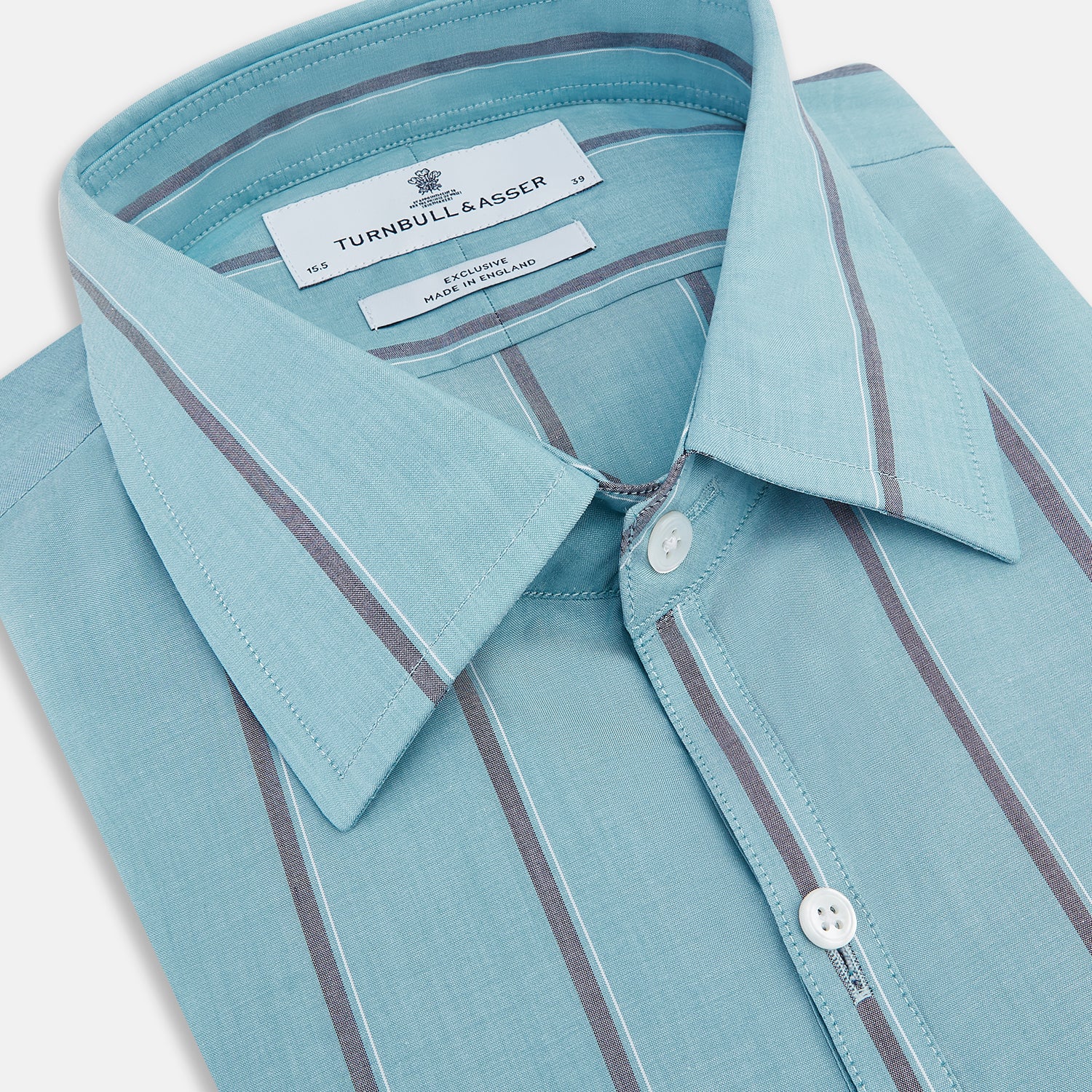 View 2 of product The Cendre Blue Track Stripe Westminster Shirt by Turnbull & Asser features a light blue hue, dark vertical stripes, button-down front, classic collar, and buttoned cuffs—showcasing British craftsmanship.
