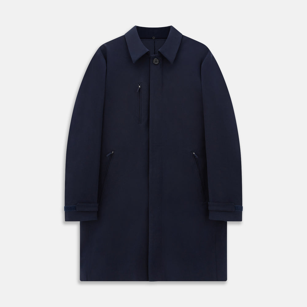 A Navy John Arthur Trench Coat by Turnbull & Asser, featuring a collar, button closure, adjustable cuff straps, two slanted front pockets, and a chest zip pocket, is displayed flat on a white background.