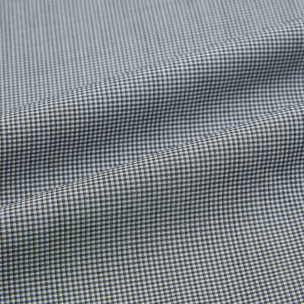 The Turnbull & Asser Grey and White Micro Check Westminster Shirt features long sleeves, a button-up front, a Westminster collar, and white buttons, shown flat on a white background.