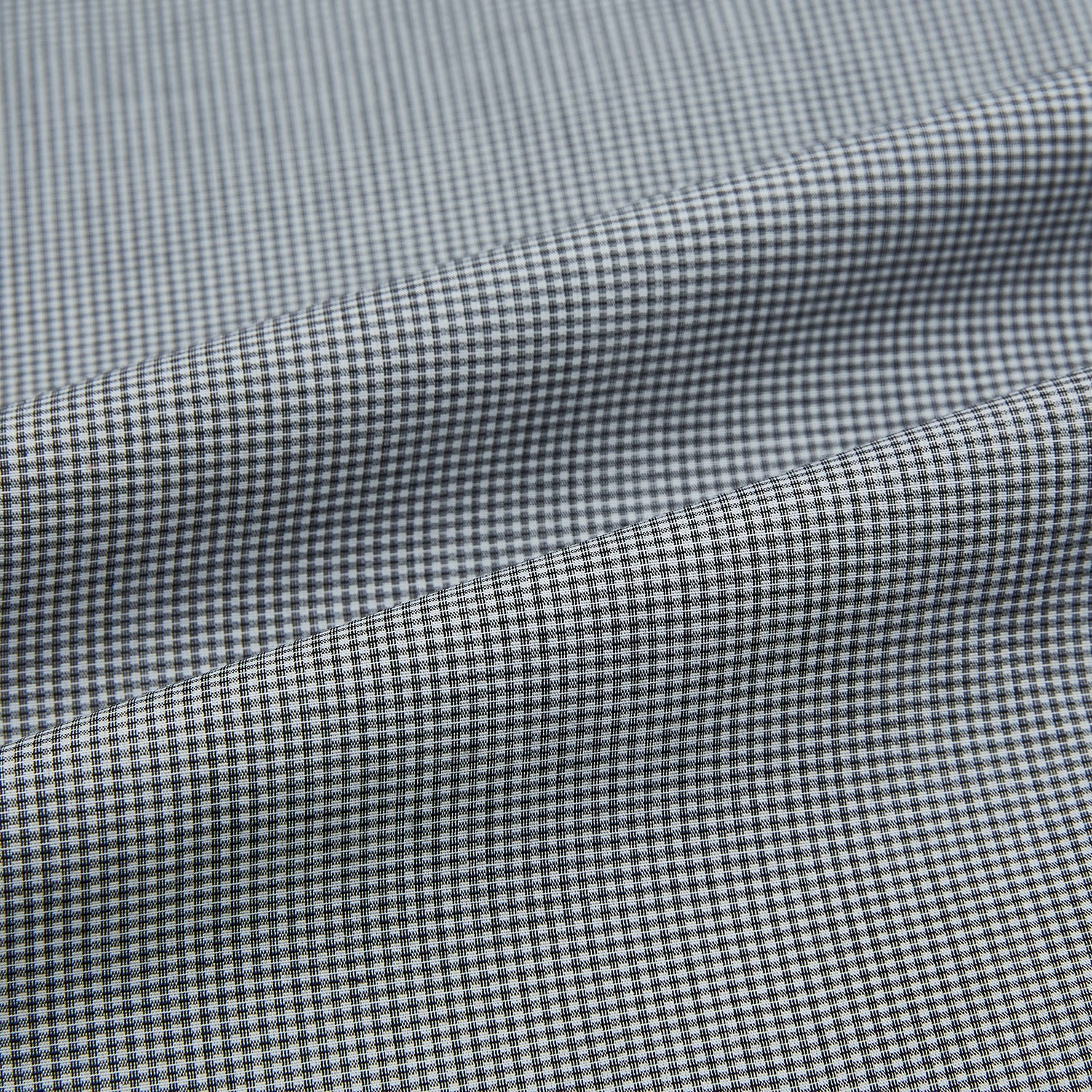 View 7 of product The Turnbull & Asser Grey and White Micro Check Westminster Shirt features long sleeves, a button-up front, a Westminster collar, and white buttons, shown flat on a white background.