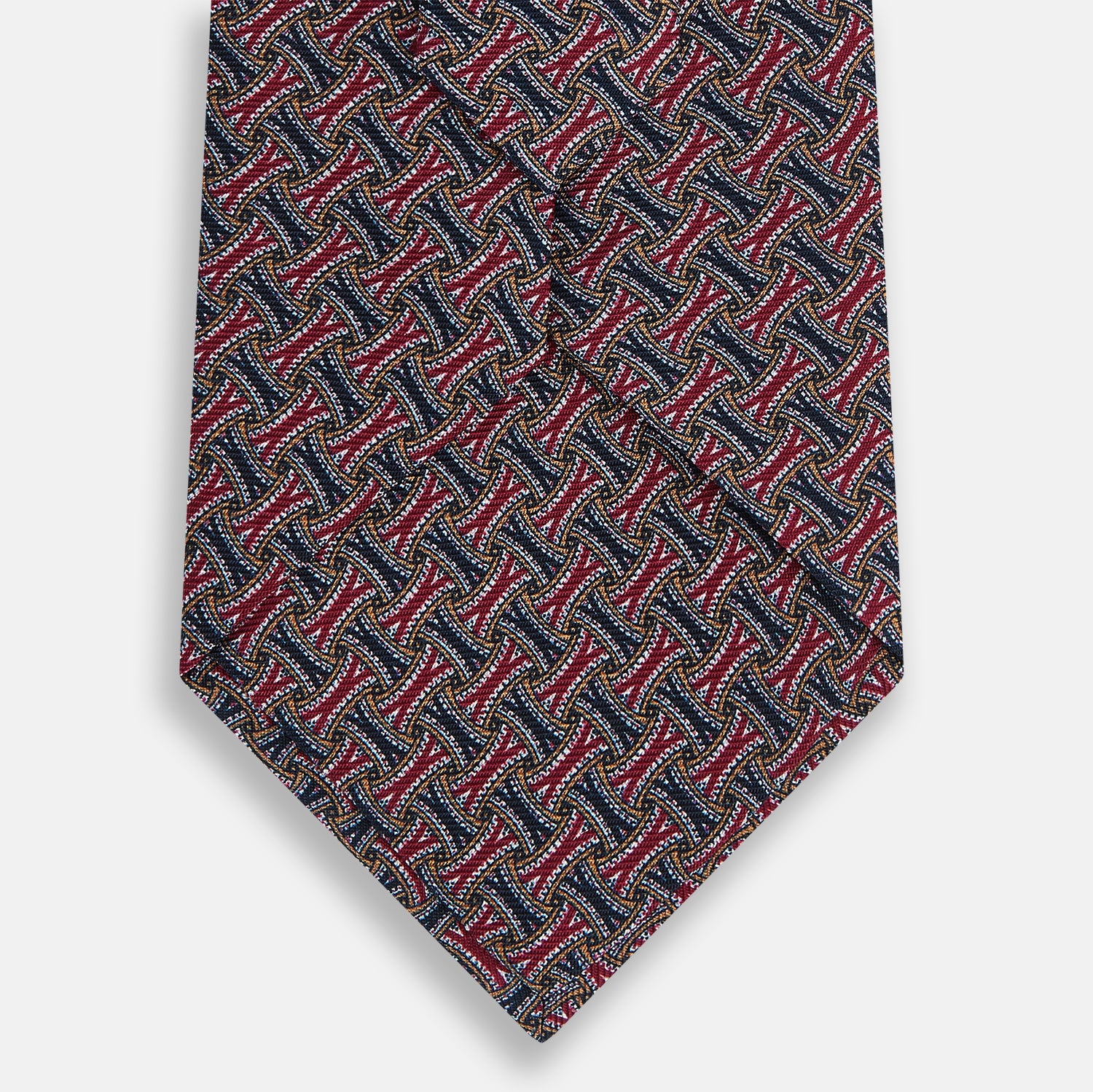 View 3 of product The Turnbull & Asser Burgundy and Navy Weave Patterned Silk Tie features a geometric design in rich tones on silk fabric.