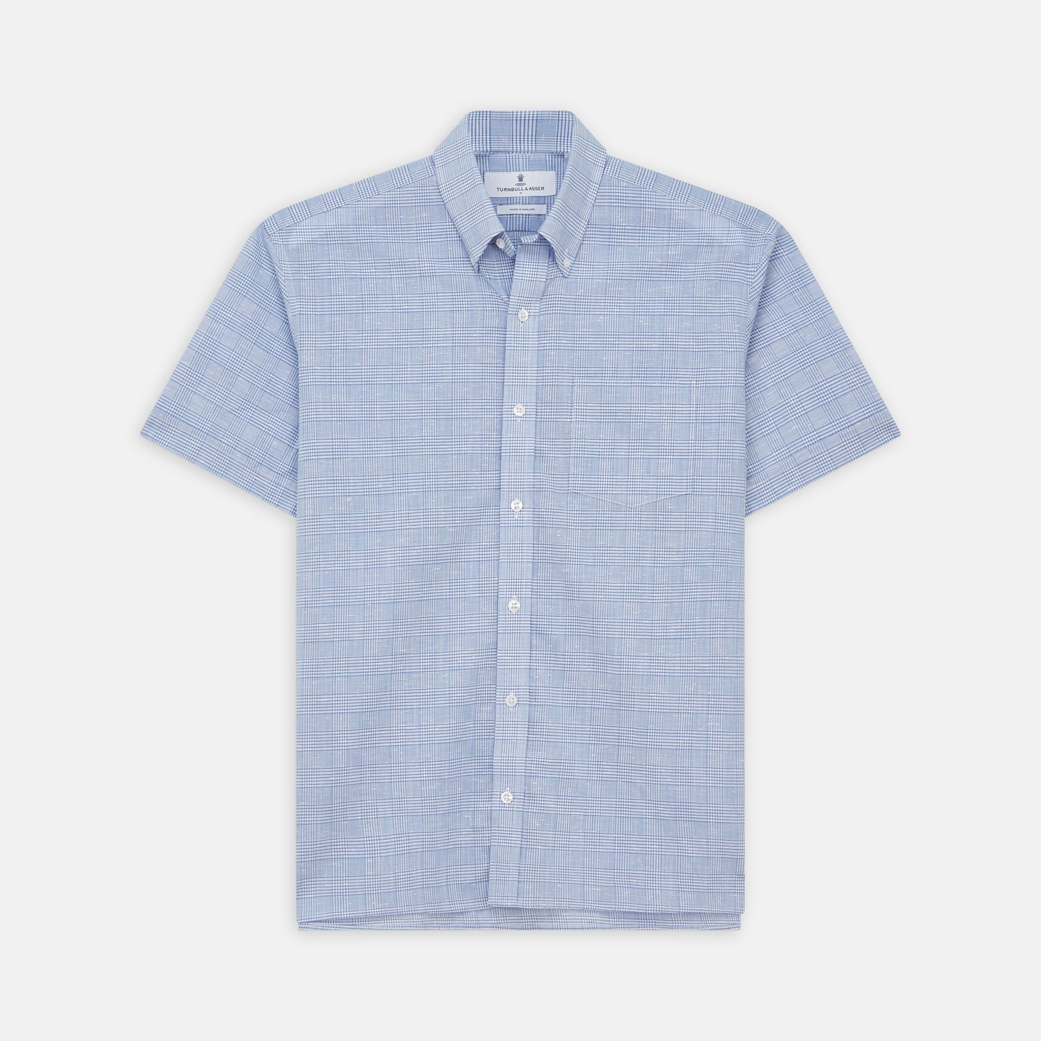 View 2 of product Close-up of Turnbull & Asser’s Pale Blue Multi Check Cotton Fabric featuring a light blue and white crisscross plaid pattern, displayed inside a circular frame with a gray border. The cloth shows slight wrinkling.