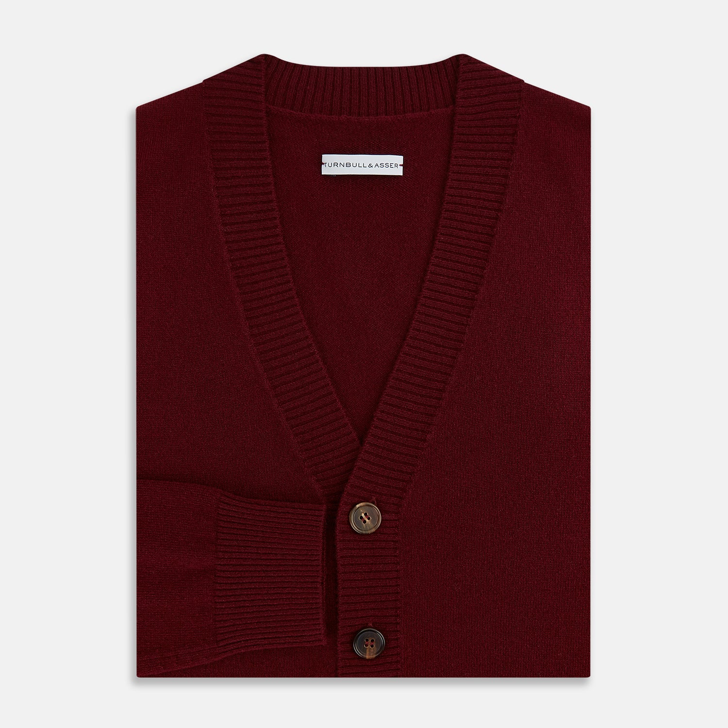 View 4 of product The Turnbull & Asser Burgundy Cashmere Cardigan features a V-neck, ribbed cuffs and hem, two front pockets, and a classic button-up design, shown on a plain white background.