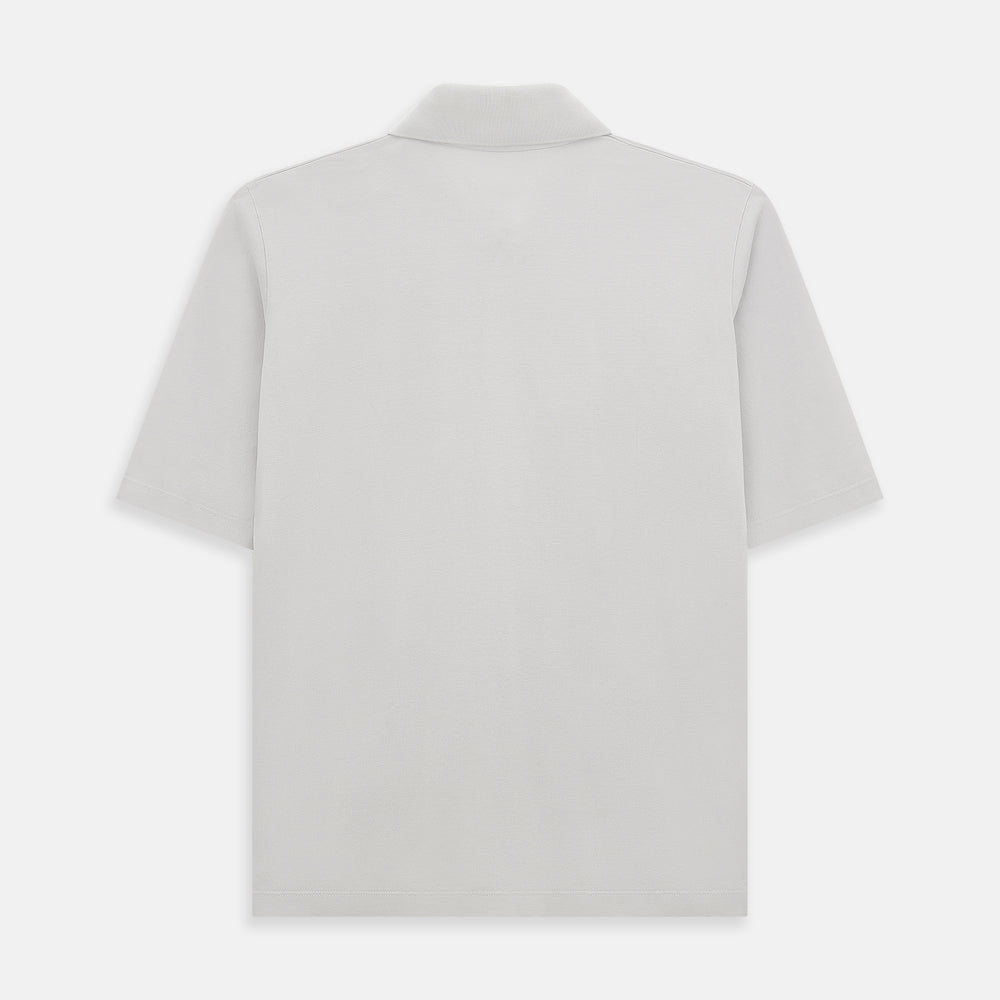 The Turnbull & Asser Pale Pink Polo Shirt is a cotton jersey short-sleeve polo with a collar, three brown buttons on the placket, and a button-flap chest pocket, shown against a white background.