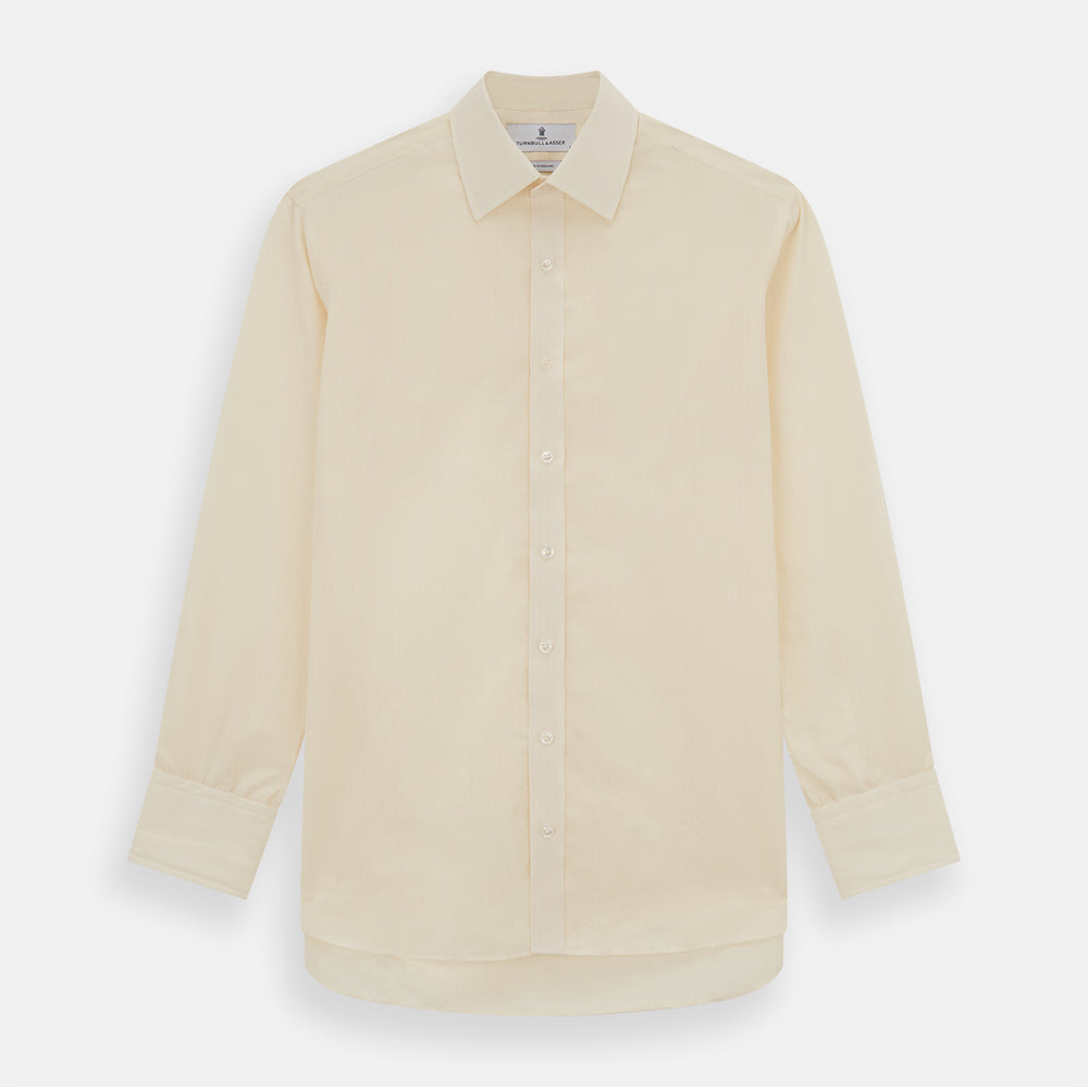 The Cream Fine Pencil Stripe Mayfair Shirt by Turnbull & Asser features long sleeves, a pointed collar, and buttoned cuffs. Crafted from breathable cotton with fine pencil stripes, it is shown laid flat on a white background.