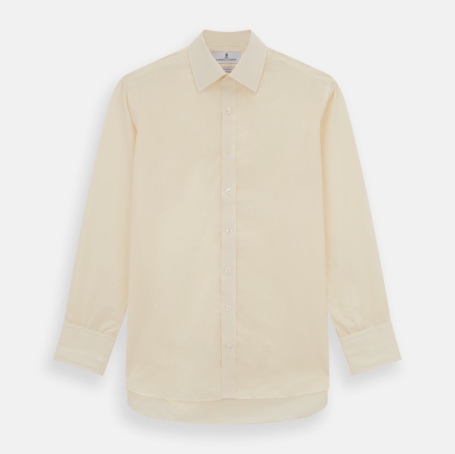 View 1 of product The Cream Fine Pencil Stripe Mayfair Shirt by Turnbull & Asser features long sleeves, a pointed collar, and buttoned cuffs. Crafted from breathable cotton with fine pencil stripes, it is shown laid flat on a white background.
