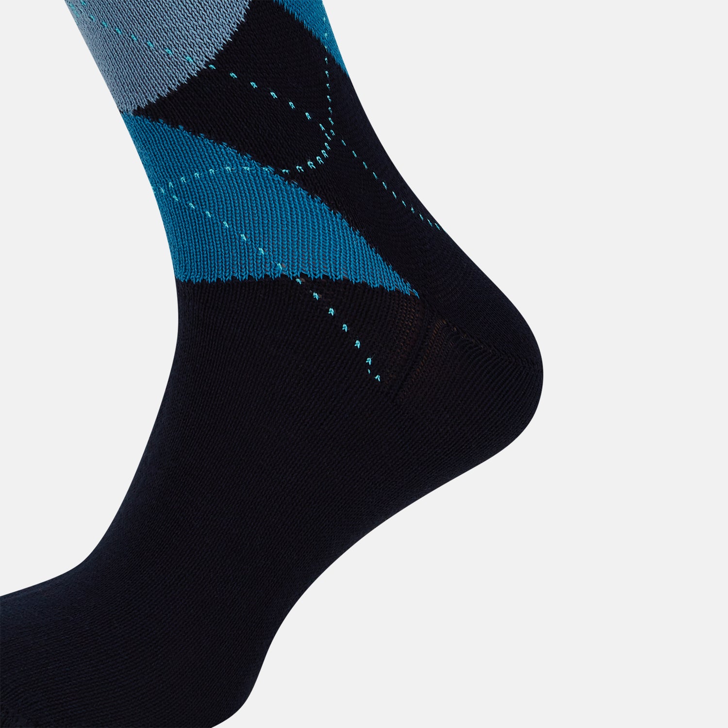 View 4 of product The Turnbull & Asser Navy Check Mid-Length Sock, crafted from ultra-soft cotton, features a blue and light blue argyle pattern with diamond shapes and dotted lines, and is showcased against a plain white background.