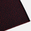 View 2 of product The Turnbull & Asser Navy and Burgundy Diamond-Patterned Cashmere Knitted Scarf, displayed upright on a plain white background, exudes sumptuous softness.