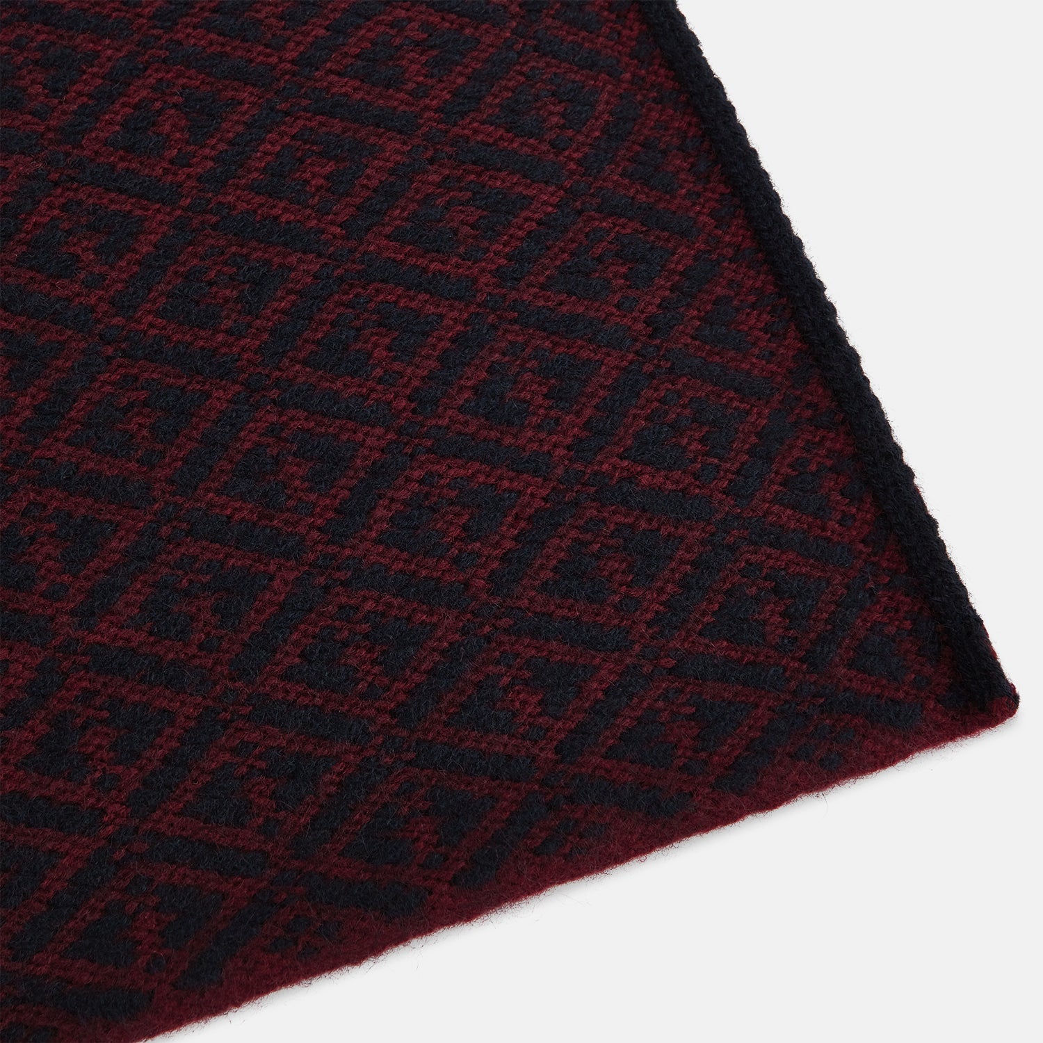 View 2 of product The Turnbull & Asser Navy and Burgundy Diamond-Patterned Cashmere Knitted Scarf, displayed upright on a plain white background, exudes sumptuous softness.