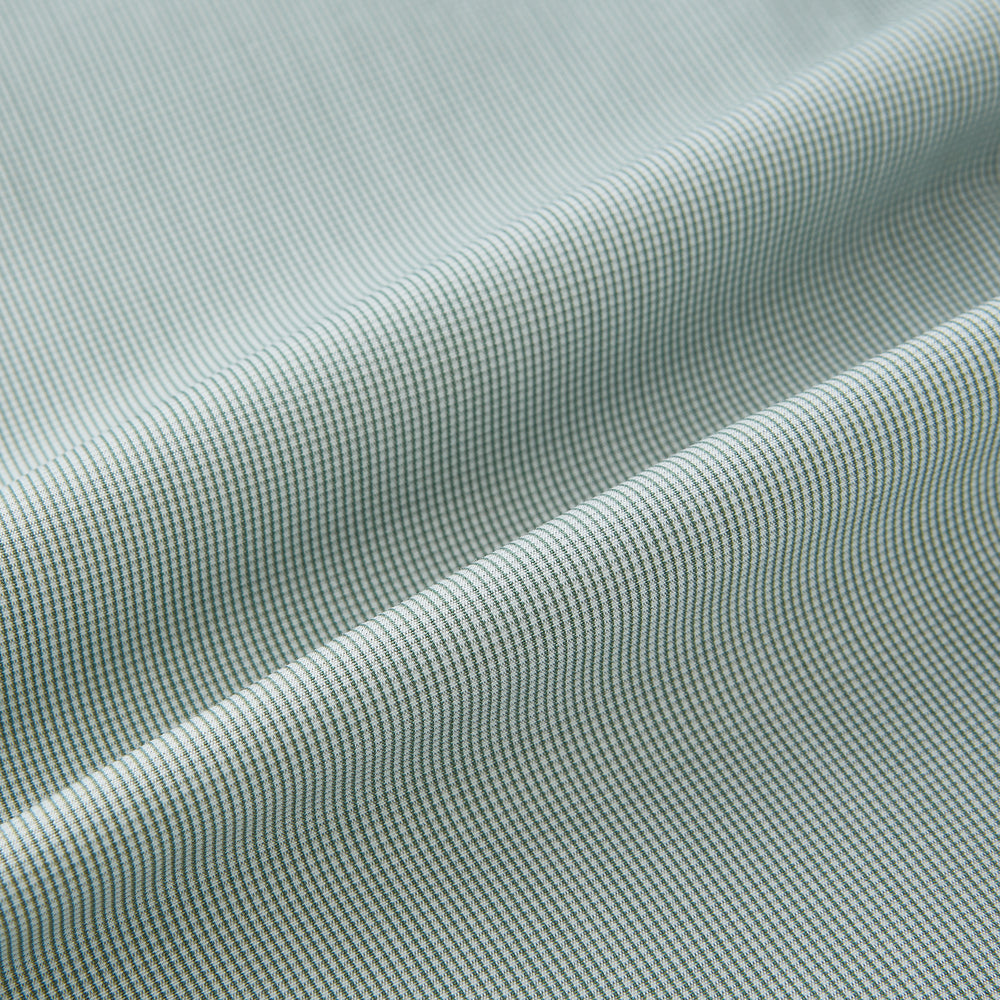 A dark green micro graph check Westminster shirt by Turnbull & Asser, featuring fine British craftsmanship, a Turnbull collar, and white buttons, is laid flat on a white background.