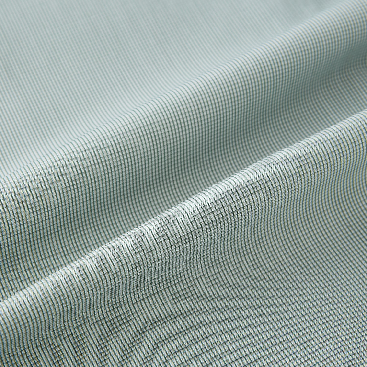 View 8 of product A dark green micro graph check Westminster shirt by Turnbull & Asser, featuring fine British craftsmanship, a Turnbull collar, and white buttons, is laid flat on a white background.