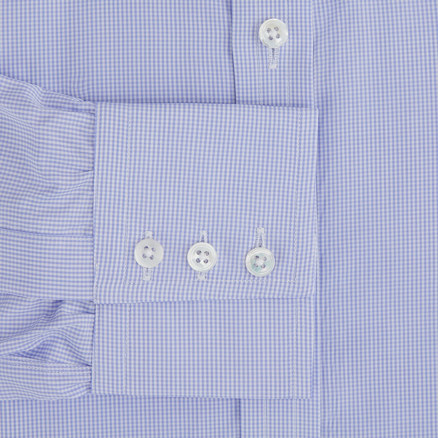 View 4 of product The Turnbull & Asser Blue Fine Check Sea Island Quality Cotton Shirt features a T&A collar, 3-button cuffs, and white buttons, shown on a plain white background.