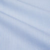 View 2 of product The Turnbull & Asser Micro Blue Check with White Collar and Cuff Shirt, a light blue long-sleeve style, features contrasting white collar and cuffs, buttoned down the front and laid flat on a white background.
