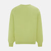 View 3 of product The Turnbull & Asser Melon Green Merino V-Neck Jumper is shown on a white background, featuring long sleeves, ribbed cuffs, and a ribbed hem.