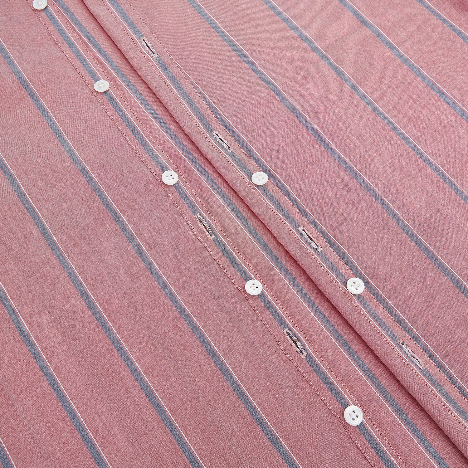 View 7 of product The Turnbull & Asser Red Track Stripe Westminster Shirt features British craftsmanship, a collar, pink base with vertical blue and white stripes, white buttons, and a pocket-free front for refined appeal.