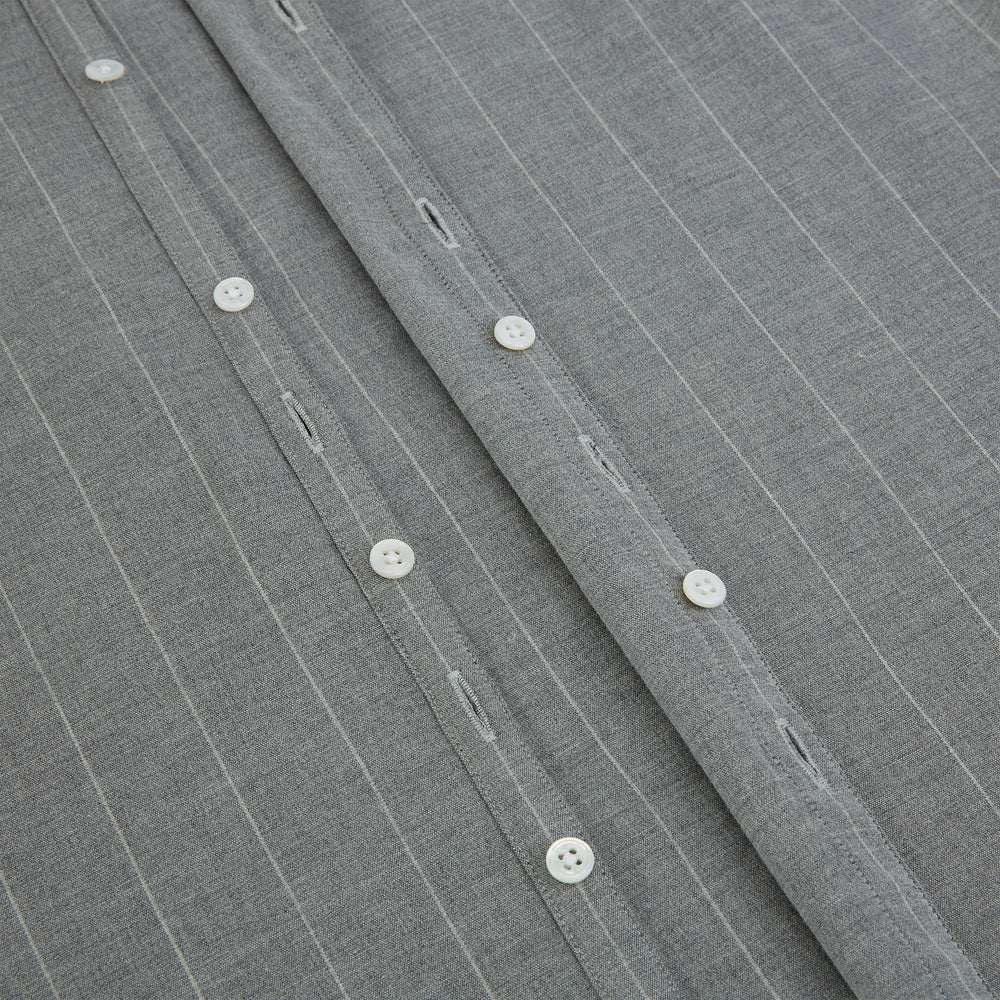 The Grey Wide Stripe Westminster Shirt by Turnbull & Asser features long sleeves, buttoned cuffs, a Turnbull collar, and classic British craftsmanship, shown on a white background.