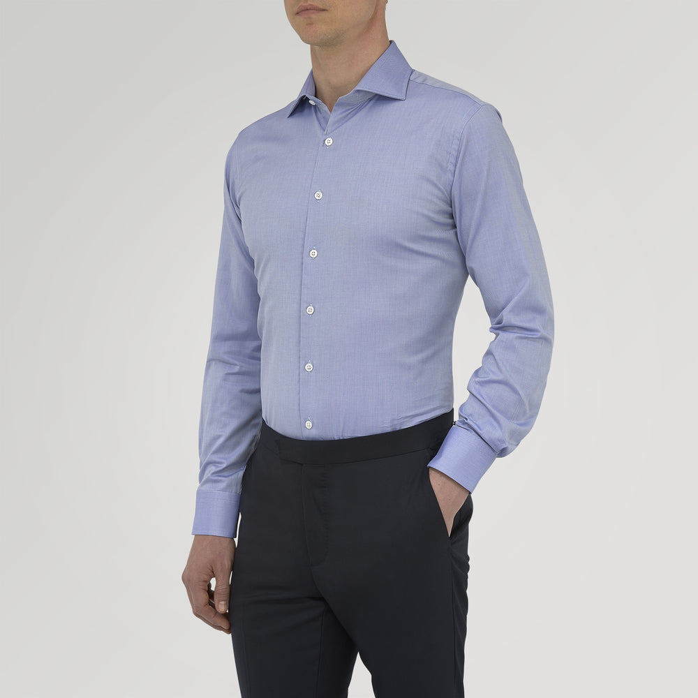 A Turnbull & Asser Tailored Fit Blue Royal Oxford Cotton Shirt with a Kent collar and 2-button cuffs is neatly displayed on a white background, highlighting its refined design and quality craftsmanship.