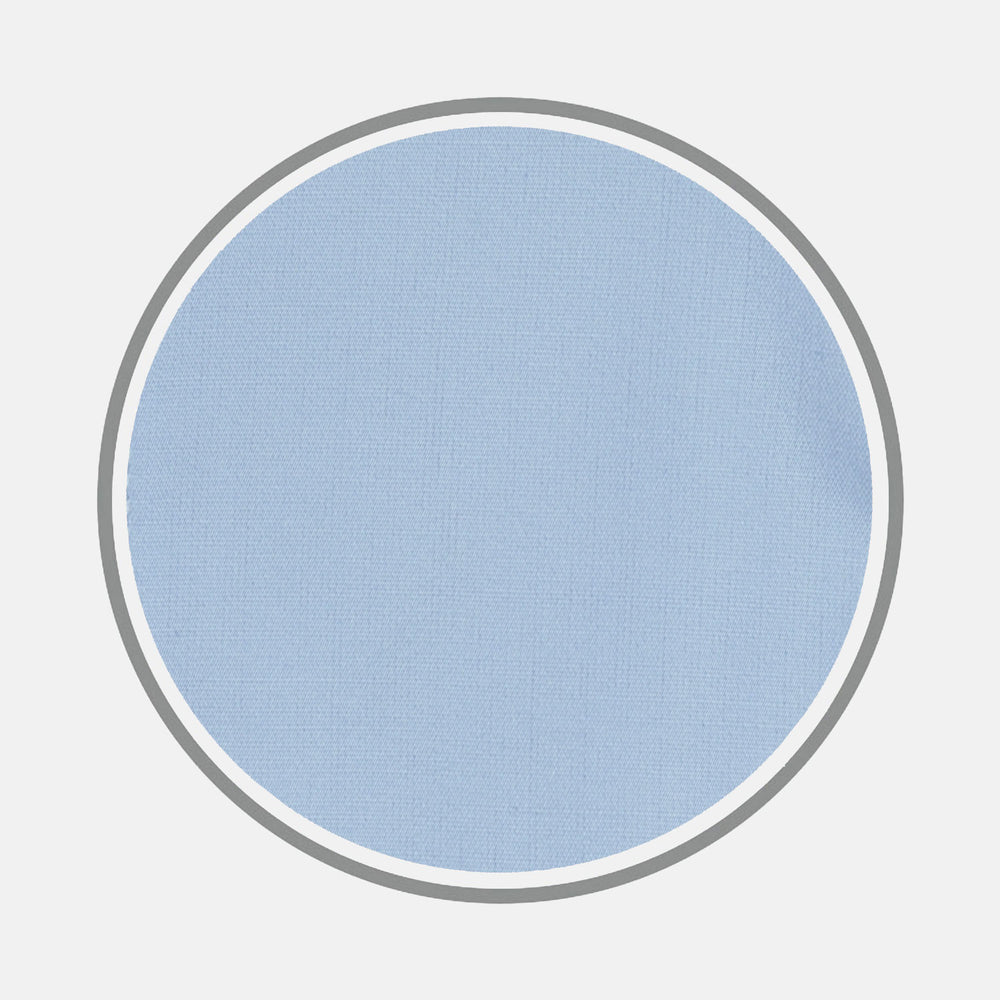A circular swatch of Turnbull & Asser Blue Cotton Fabric with a subtle texture is shown on a plain white background, outlined by a thin gray border.