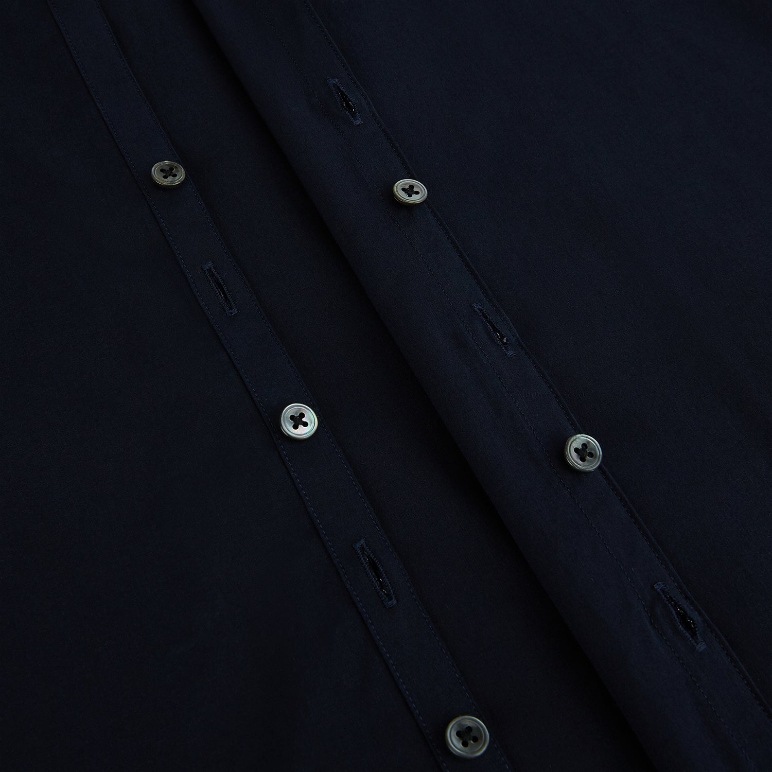 View 7 of product The NAVY BLUE WINDSOR SHIRT by Turnbull & Asser features long sleeves, a classic Windsor collar, white buttons, and buttoned cuffs—highlighting refined British craftsmanship against a plain white background.