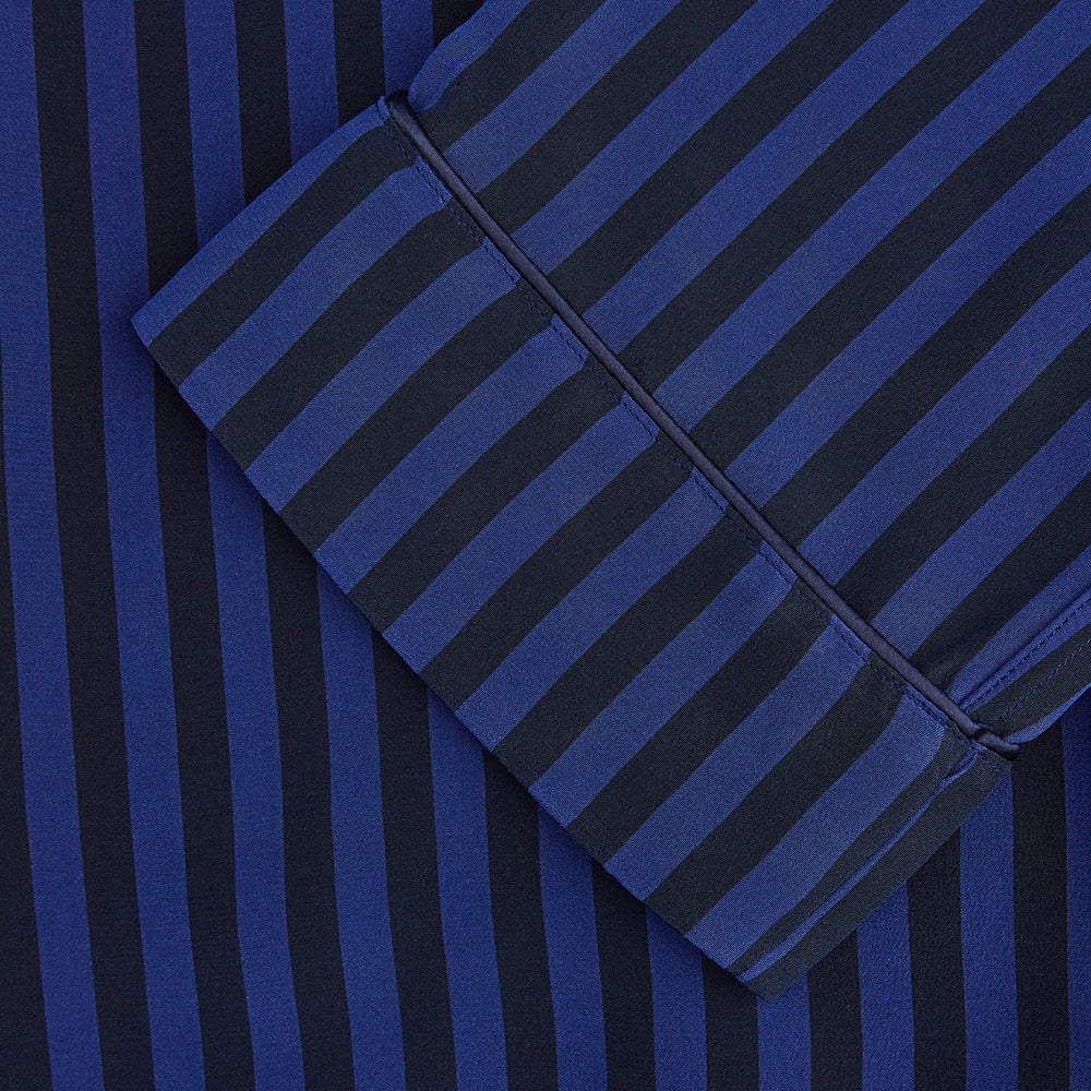 The Turnbull & Asser Blue and Navy Candy Stripe Silk Hyde Pyjamas Set features a long-sleeve button-up top with a chest pocket and elastic-waist pants, shown on a plain white background.