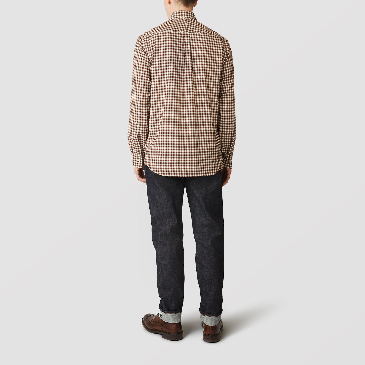 View 3 of product The Turnbull & Asser Brown Check Weekend Fit Shirt features a Derby collar, 1-button cuffs, and a brown check pattern—ideal for winter layering. Shown against a plain white background.
