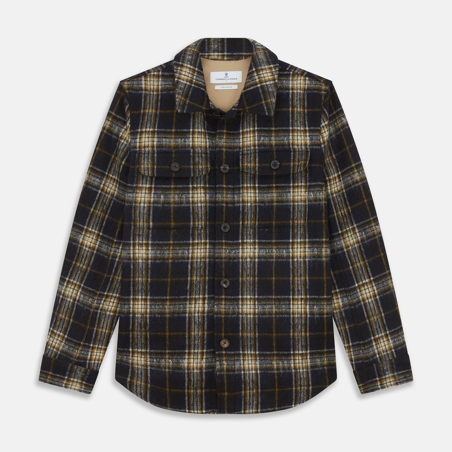 View 1 of product The Turnbull & Asser Navy and Beige Check Wool and Mohair Blend Somerset Overshirt, featuring long sleeves, two chest pockets, and a classic collar, is laid flat on a white background.