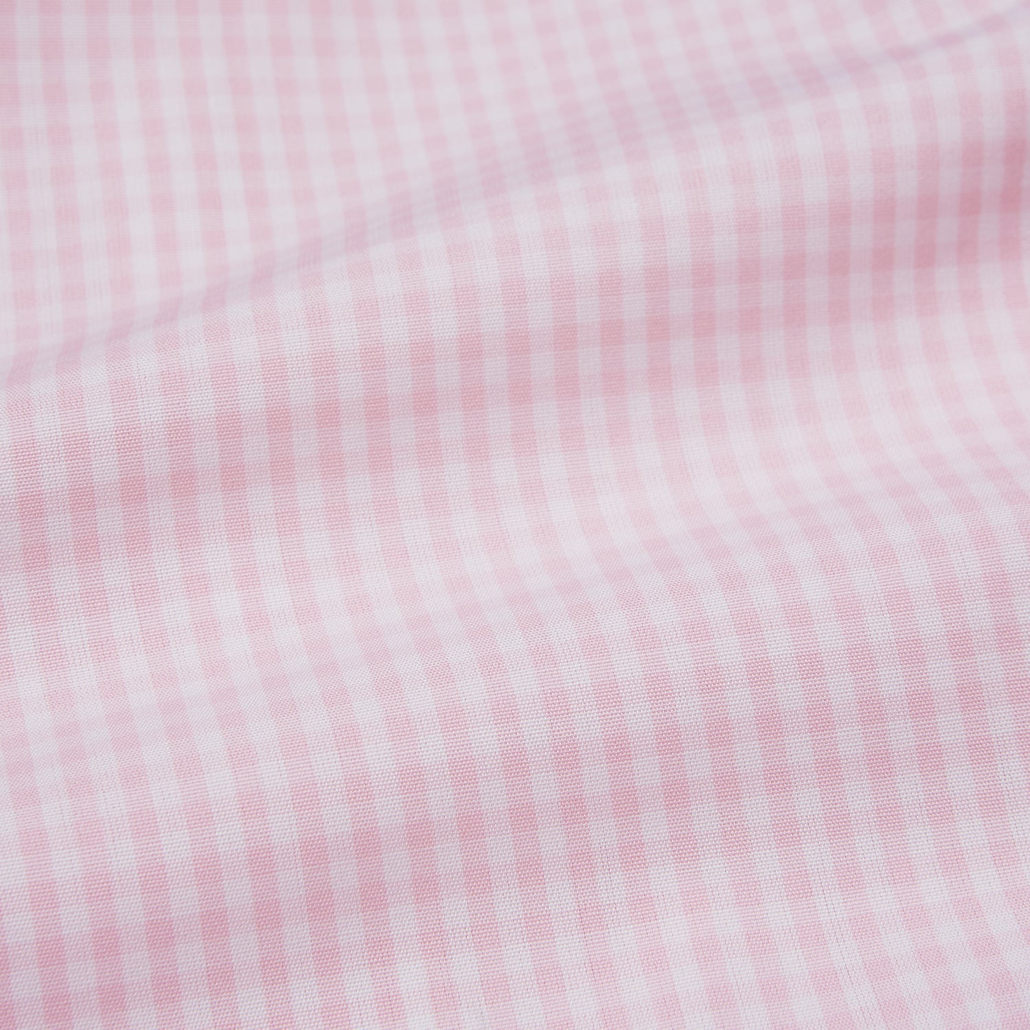 View 5 of product The Pink Windowpane Check Mayfair Shirt by Turnbull & Asser is crafted in light pink organic cotton with a subtle windowpane check, button-down front, and pointed collar, displayed flat on a white background.