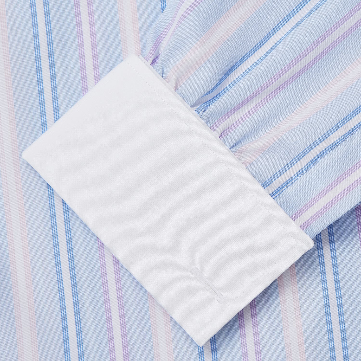 View 3 of product The Turnbull & Asser Light Blue Multi Stripe Cotton Regular Fit Penrose Shirt features light blue, white, and pink stripes with a crisp white collar and cuffs, displayed on a white background.