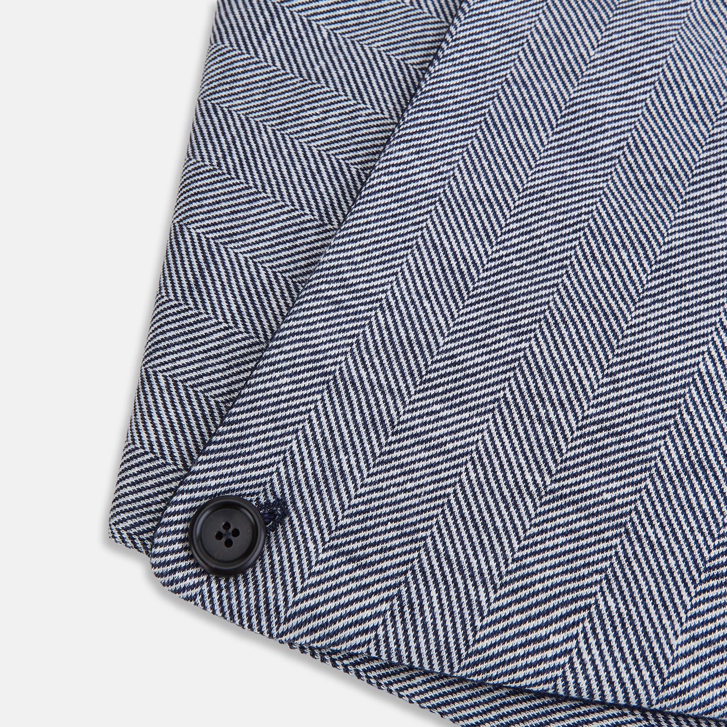 View 4 of product The Turnbull & Asser Navy Herringbone Silk and Linen Neck Warmer features a grey and white pattern, button closure, and dark navy lining—a refined formal accessory for any wardrobe.