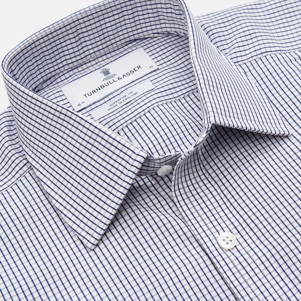 The Navy Check Cotton Regular Fit Mayfair Shirt by Turnbull & Asser features a timeless checked pattern for a classic look.