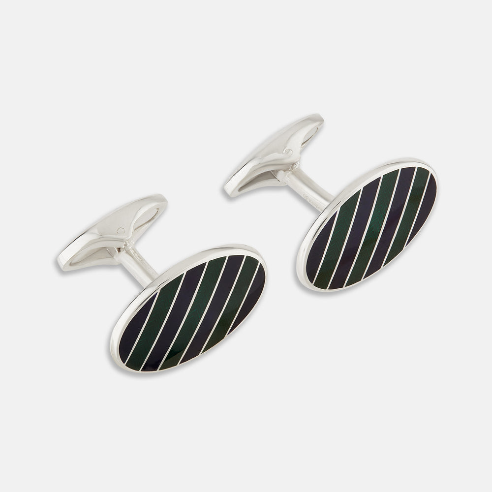 The Forest Green and Navy Striped Oval Enamel Cufflinks by Turnbull & Asser feature artisanal craftsmanship and a bold, masculine design, with elegant stripes set on a classic silver finish against a sophisticated white backdrop.