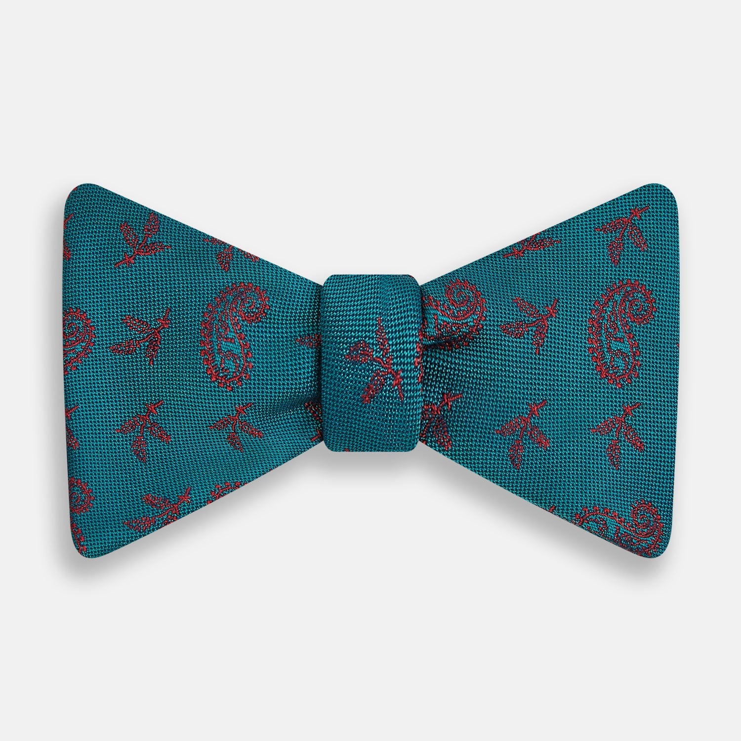 View 1 of product The Turnbull & Asser Teal Paisley Silk Bow Tie, featuring a red paisley and bee pattern, adds a touch of British elegance and formal refinement to your ensemble.