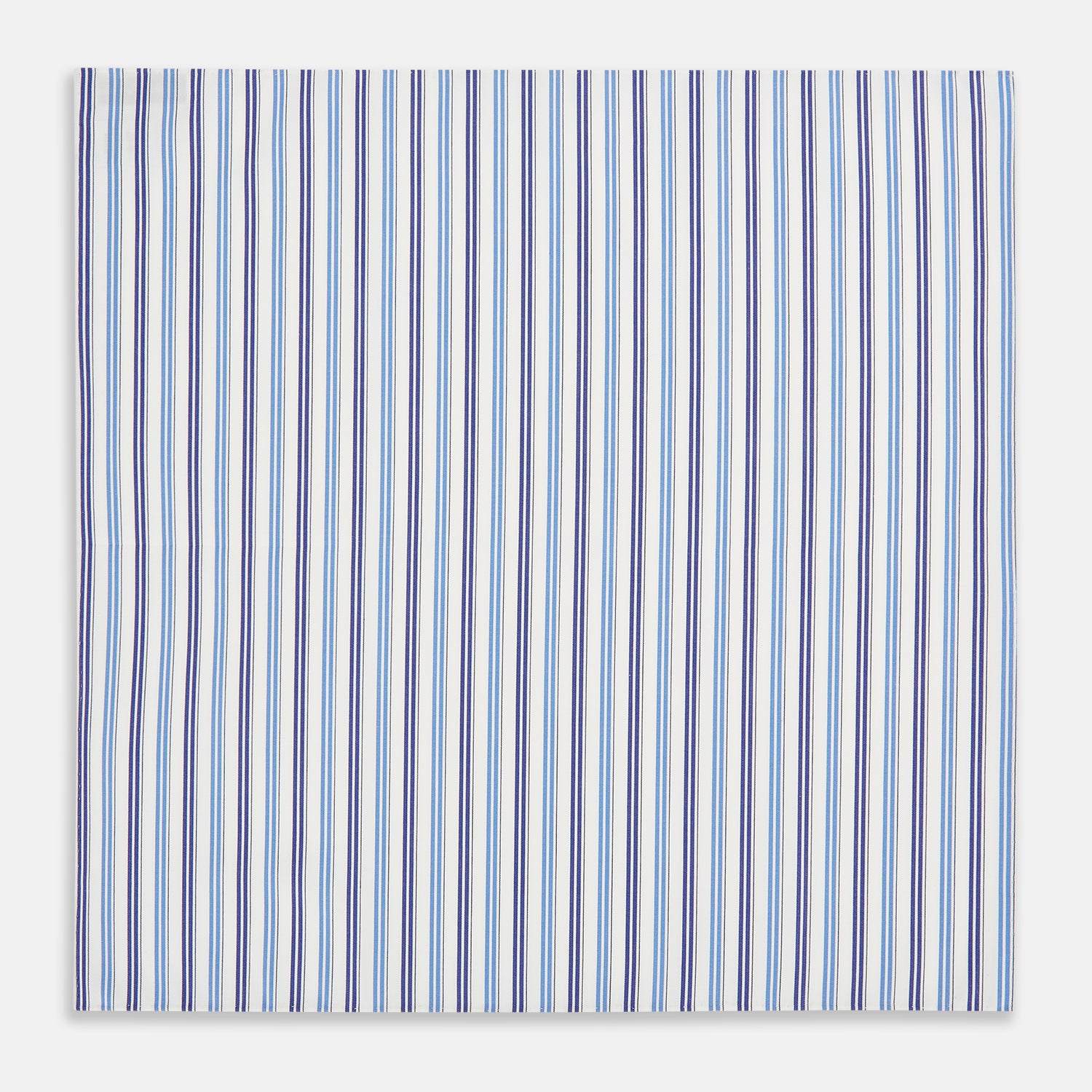 View 3 of product The Blue and Navy Multi Stripe Hand-Rolled Handkerchief by Turnbull & Asser is crafted in England with a white background and evenly spaced vertical stripes in blue and navy.