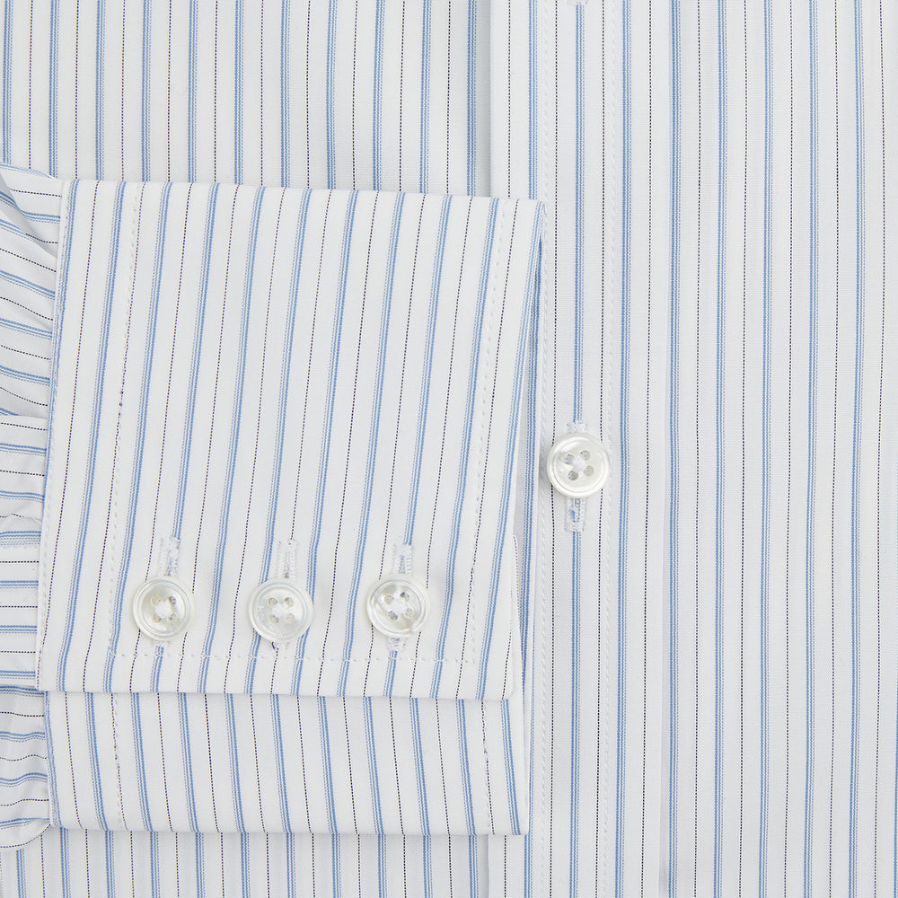 The Turnbull & Asser Sky Blue Combination Stripe Mayfair Shirt features long sleeves, a T&A collar, buttoned cuffs, and thin vertical stripes in blue, shown on a plain white background.