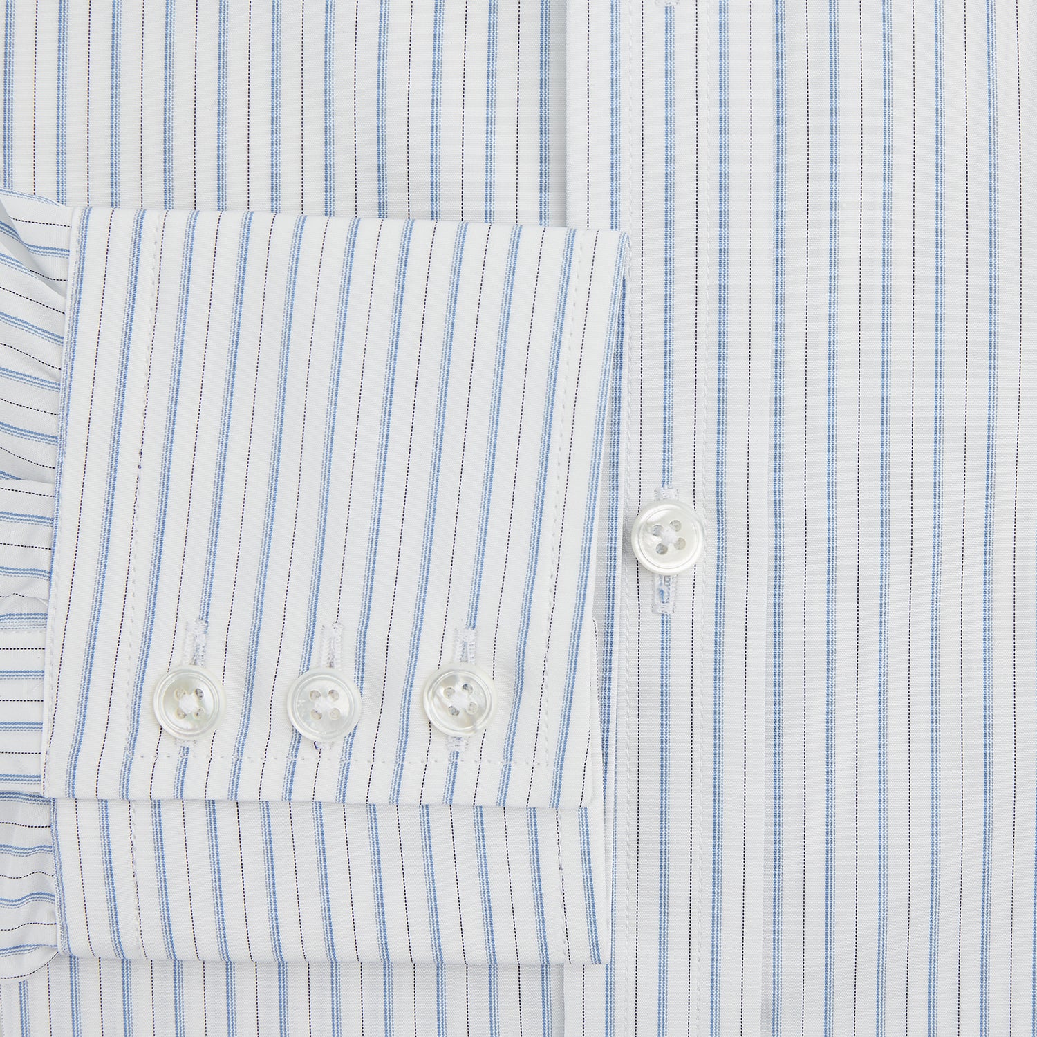 View 4 of product The Turnbull & Asser Sky Blue Combination Stripe Mayfair Shirt features long sleeves, a T&A collar, buttoned cuffs, and thin vertical stripes in blue, shown on a plain white background.