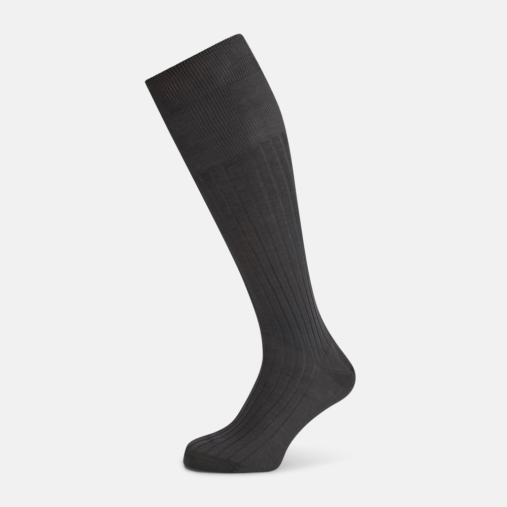 A single Concrete Grey Long Sock by Turnbull & Asser, featuring an over the calf fit and ribbed texture, is displayed on a plain white background.