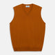 The Rust Ifor Slipover by Turnbull & Asser, a sleeveless V-neck in burnt orange, is made from lightweight Scottish cashmere and displayed flat on a white background.