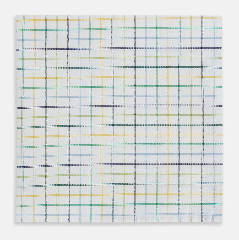 The Yellow Multi Double Grid Check Hand-Rolled Handkerchief by Turnbull & Asser is handcrafted in England, featuring a colorful check pattern with evenly spaced blue, green, yellow, and purple lines.