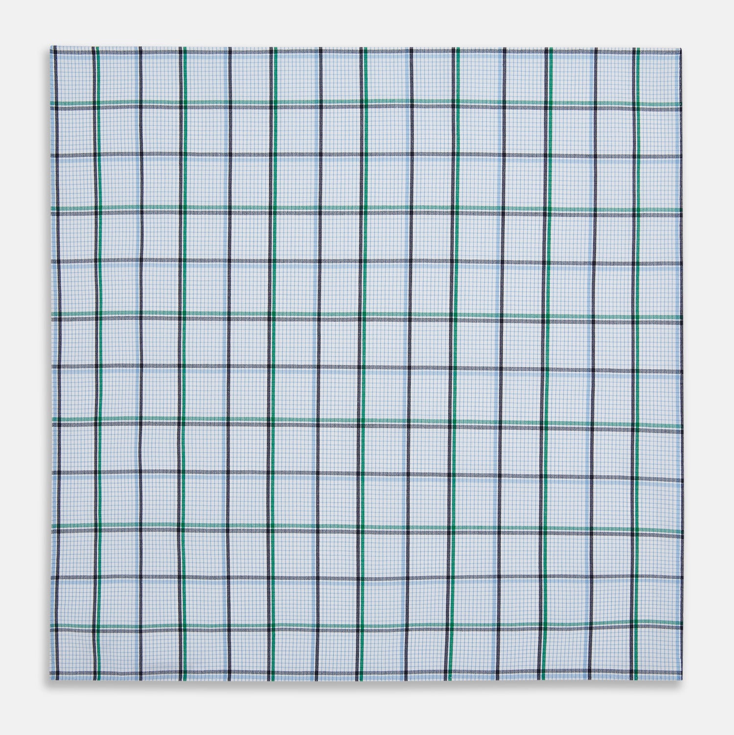 View 3 of product The Turnbull & Asser Hand Rolled Blue and Green Tattersall Check Handkerchief—a white cotton pocket square with blue, green, and black check pattern—is neatly displayed on a plain white background.