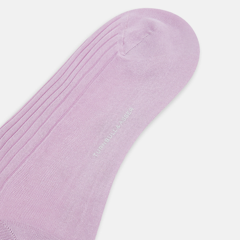 The Rose Mid-Length Socks by Turnbull & Asser are light purple, ribbed, mid-length socks made from mercerised Egyptian cotton with a hand-linked toe, shown against a plain white background.