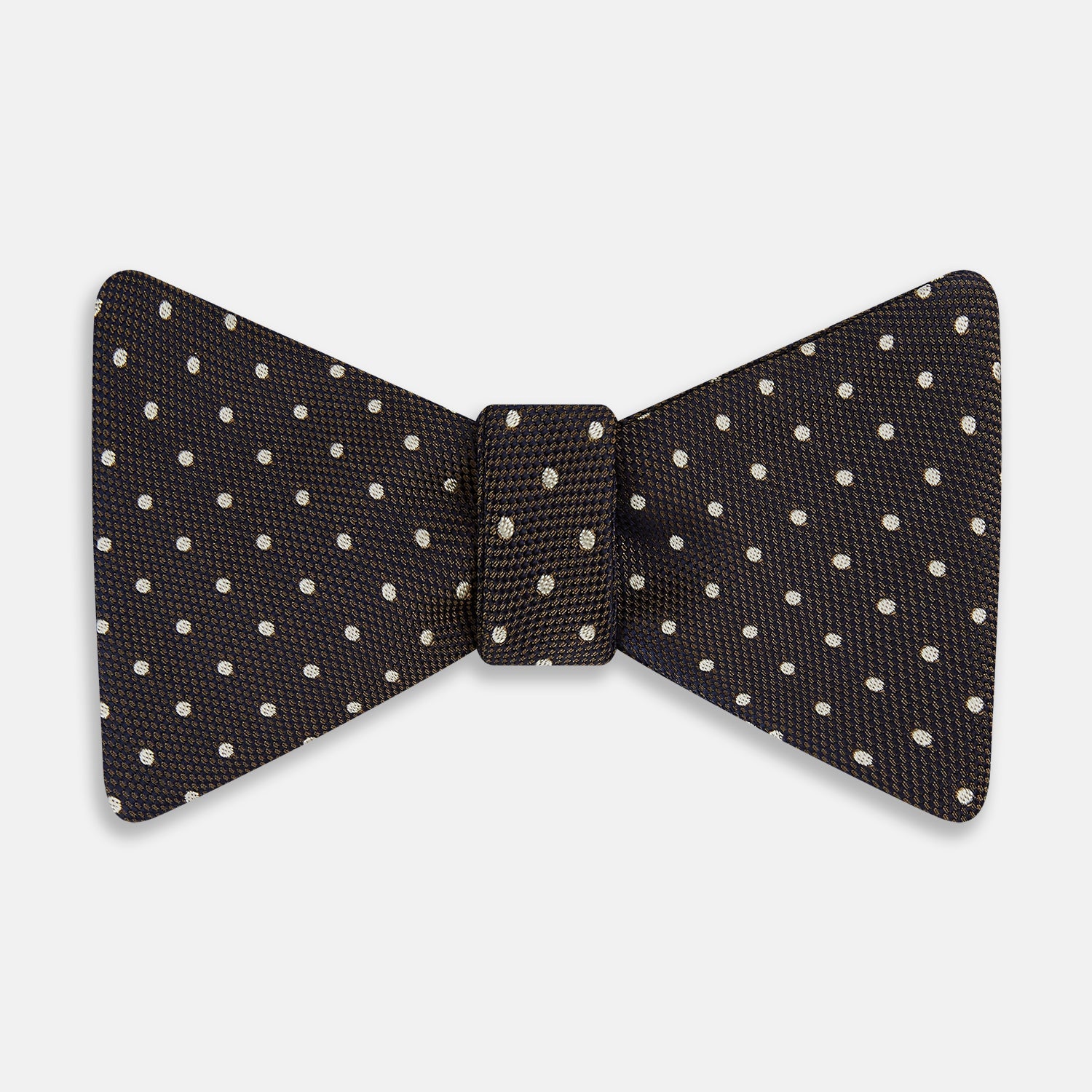 View 1 of product A stylish accessory, the White and Brown Micro Dot Silk Bow Tie by Turnbull & Asser features tiny brown dots on luxurious white silk, elegantly displayed against a plain white background.